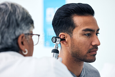 Buy stock photo Ear check, man and ENT doctor with patient consultation for hearing and wellness at hospital. Senior, employee and otoscope test of physician with healthcare work and consulting exam with expert