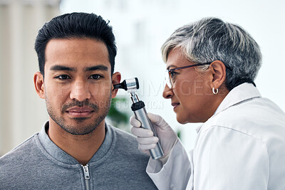 Buy stock photo Ear check, woman and ENT doctor with patient consultation for hearing and wellness at hospital. Senior, employee and otoscope test of physician with health insurance and consulting exam for tinnitus