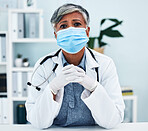 Healthcare, face mask and portrait of a female doctor in her office in the hospital for disease diagnosis. Gloves, concern and professional senior woman medical worker with virus prevention in clinic