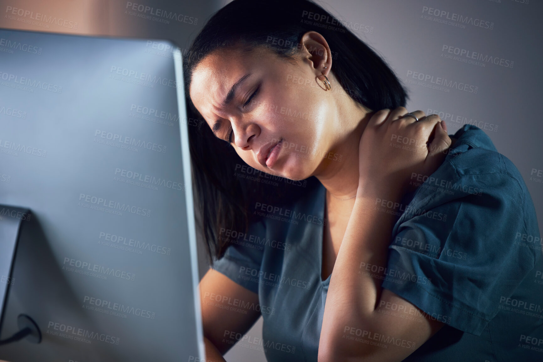 Buy stock photo Business woman, neck pain and night in burnout, stress or fatigue by computer at office. Frustrated, overworked and tired female person with sore shoulder, muscle or tension working late at workplace