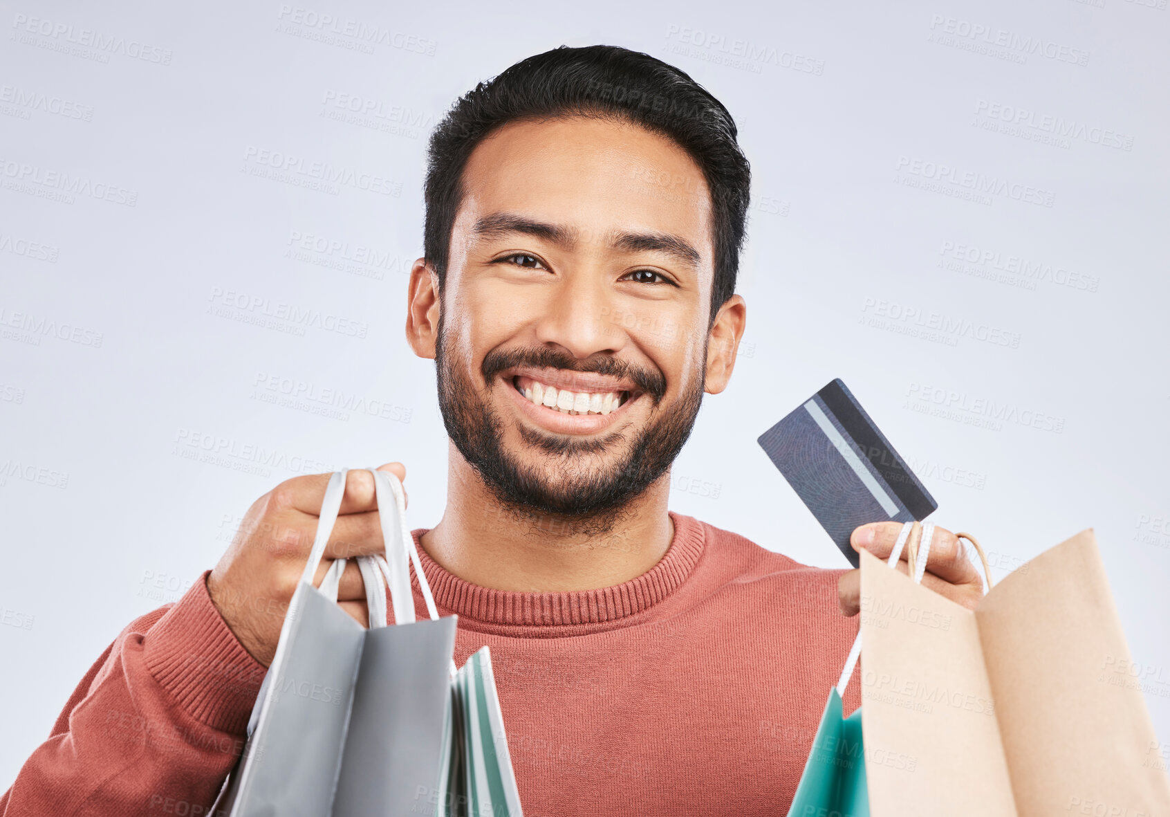 Buy stock photo Shopping bag, portrait and man with happiness, credit card and smile for retail fashion spree, sales or Black Friday deal. Promotion face, studio payment and happy male customer on white background