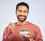 Fruit, portrait and happy asian man in studio for health, wellness and detox on grey background. Breakfast, salad and face of guy nutritionist smile for healthy, clean or raw diet for vegan lifestyle