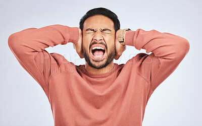 Buy stock photo Shouting, anxiety and hands on ears of asian man in studio with headache, brain fog or frustrated on grey background. Noise, stress and angry guy person scream for tinnitus, depression or vertigo
