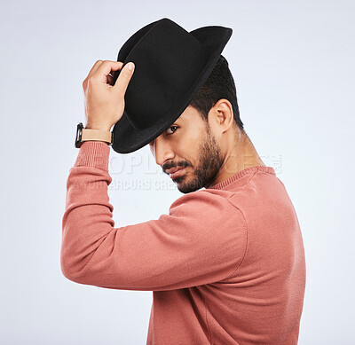 Buy stock photo Retro, fashion and portrait of man with a hat for vintage style or hipster clothing trend in white background. Studio, Indian model and serious face with cool, confidence or person acting as a spy