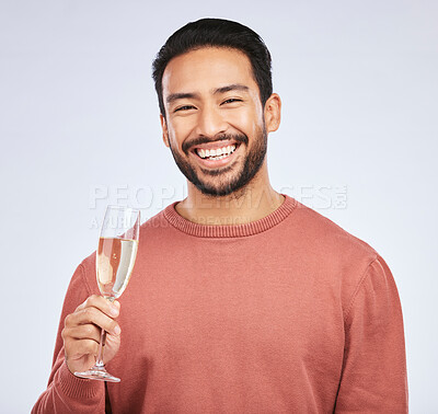 Buy stock photo Champagne, portrait and asian man with glass in studio for success, celebration or victory on grey background. Wine, face and happy guy winner celebrating promotion, announcement or competition prize
