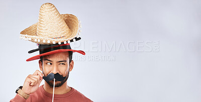Buy stock photo Photo booth mockup, hat and face of man in studio with mustache for comic, humor and funny joke. Happy, Mexican party accessory and excited male person on gray background with sombrero for comedy