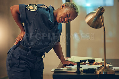 Buy stock photo Police, woman and back pain in a cop station with spine problem and injury from career. Female person, security guard and inflammation with backache from arrest accident at high risk job with stress
