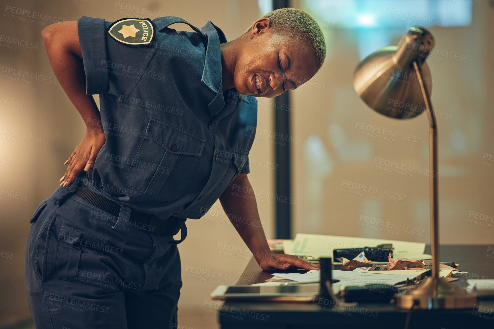 Buy stock photo Police, woman and back pain in a cop station with spine problem and injury from career. Female person, security guard and inflammation with backache from arrest accident at high risk job with stress