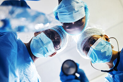 Buy stock photo Surgery, medical and a team of doctors in an operating room at the hospital for a medical procedure from patient pov. Face, mask and teamwork with a group of medicine professionals in an operation
