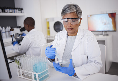Buy stock photo Science, research and a woman with a test in a lab for medicine, healthcare analytics and check. Medical, futuristic and a mature scientist studying a liquid or blood for professional results