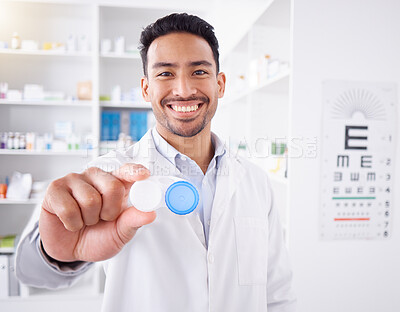 Buy stock photo Happy asian man, doctor and contact lenses at pharmacy for sight, vision or healthcare solution at store. Portrait of male person, pharmacist or medical professional smile with eye case at the clinic