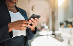 Woman, hands and phone in city for social media, communication or networking outdoors. Closeup of female person chatting, texting or typing on mobile smartphone app for online browsing in urban town