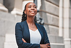 Arms crossed, happy black woman or lawyer thinking with smile or confidence working in a law firm. Court, empowerment or proud African attorney with leadership, ideas or vision for legal agency 