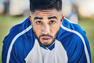 Buy stock photo Soccer player, tired or portrait of man in sports training, game or match breathing heavy on a field pitch. Face, fatigue or exhausted male athlete in football workout or fitness exercise on break 