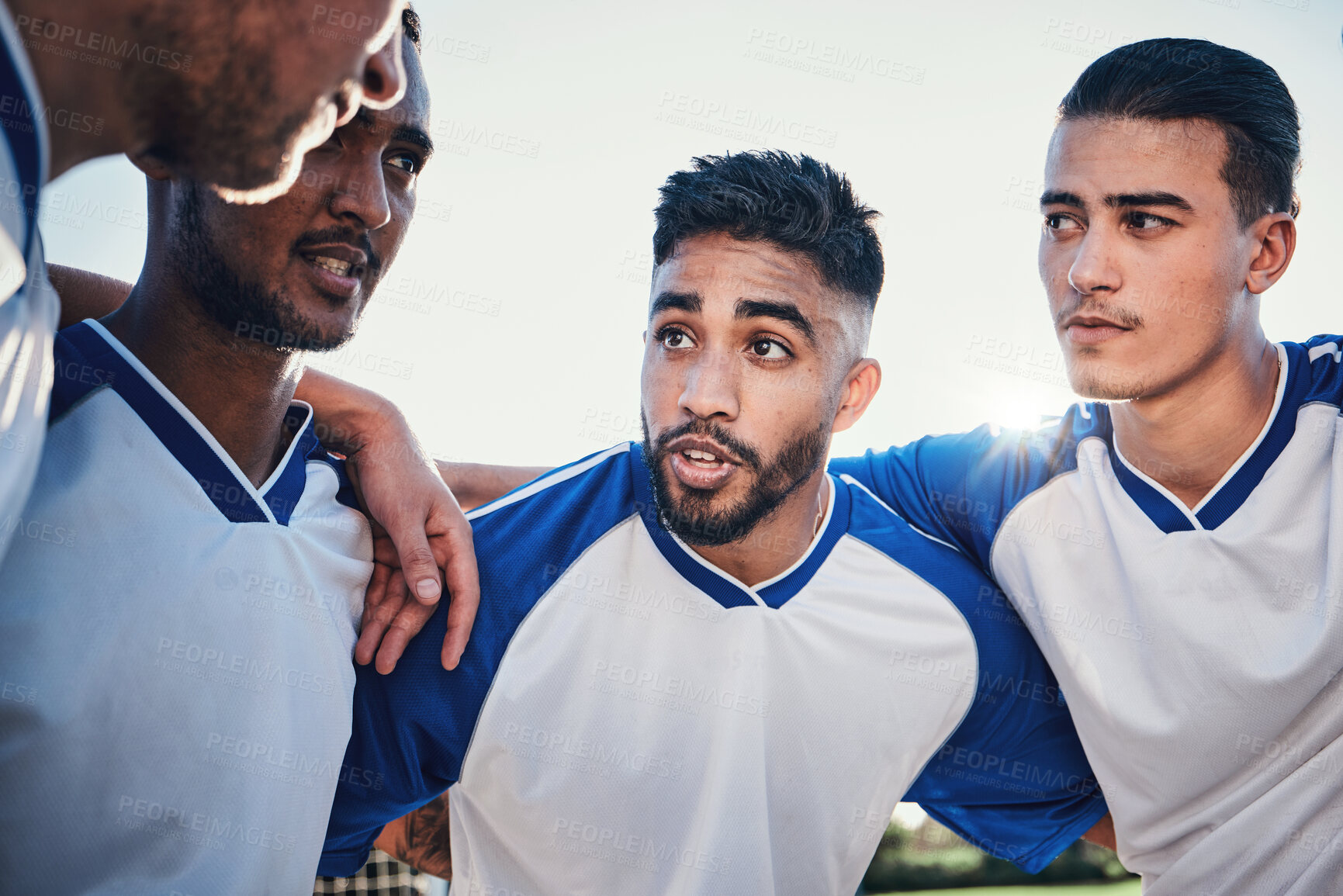 Buy stock photo Motivation, football and team captain talking in a huddle planning match strategy for collaboration, teamwork and support. Group, discussion and soccer players in solidarity together for a game