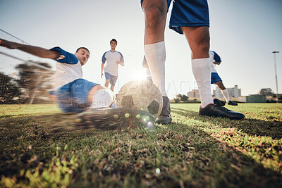 Buy stock photo Closeup, ball and soccer with men, tackle and exercise with sports, competition and training. Zoom, football and healthy athletes with energy, fitness and teamwork for a match, action and blur motion