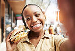 Burger, portrait and woman in selfie, city and restaurant outdoor promotion, social media and live streaming review. Fast food, happy face and african person or influencer on sidewalk for photography