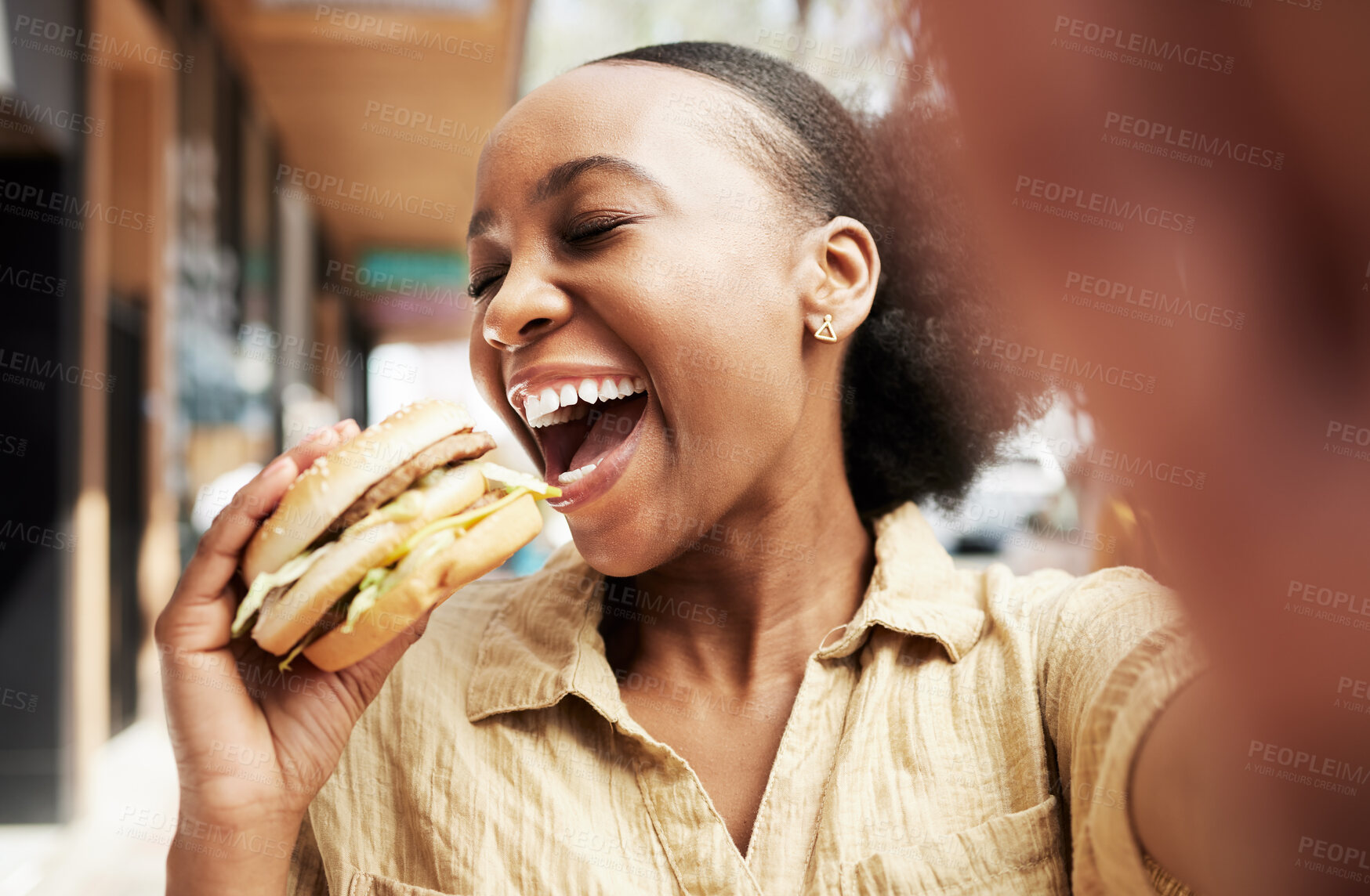 Buy stock photo Burger, eating and woman in selfie, city and restaurant outdoor promotion, social media and live streaming review. Fast food, hungry and african person, customer or influencer with lunch photography