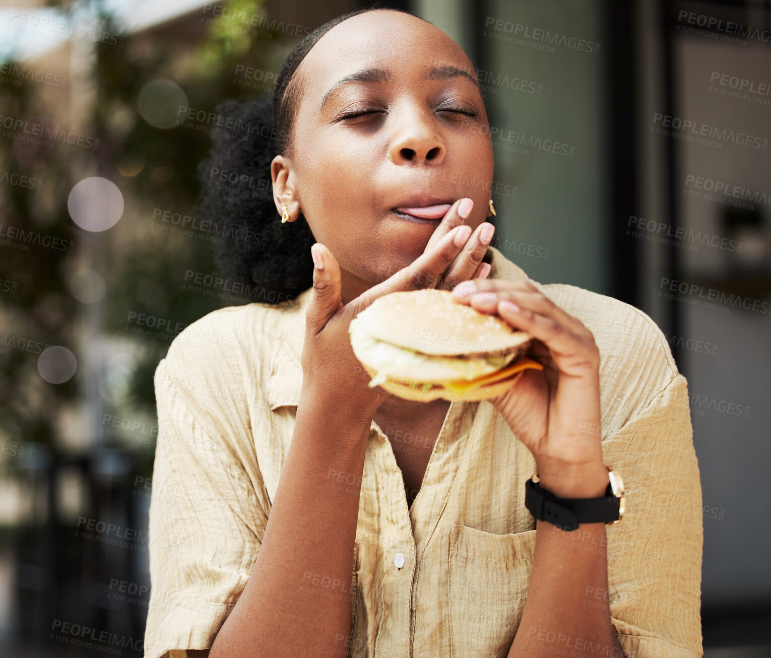 Buy stock photo Hamburger, fast food and black woman eating a brunch in an outdoor restaurant as a lunch meal craving deal. Breakfast, sandwich and young female person or customer enjoying a tasty unhealthy snack