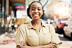 Happy, smile and portrait of woman in the city walking for exploring, travel or sightseeing. Happiness, excited and headshot of African female person with crossed arms for confidence in an urban town