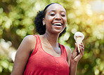 Portrait, black woman and smile with ice cream cone for dessert, cool snack and sweet food outdoor in summer, nature and garden. Happy female person eating scoop of frozen vanilla gelato in park 