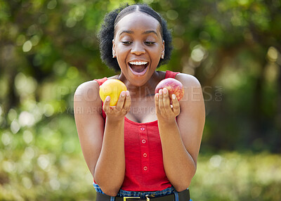 Buy stock photo Happy black woman, lemon and apple in surprise for vitamin C, natural nutrition or diet in nature. African female person with citrus and organic fruit for healthy eating, fiber and wellness outdoors
