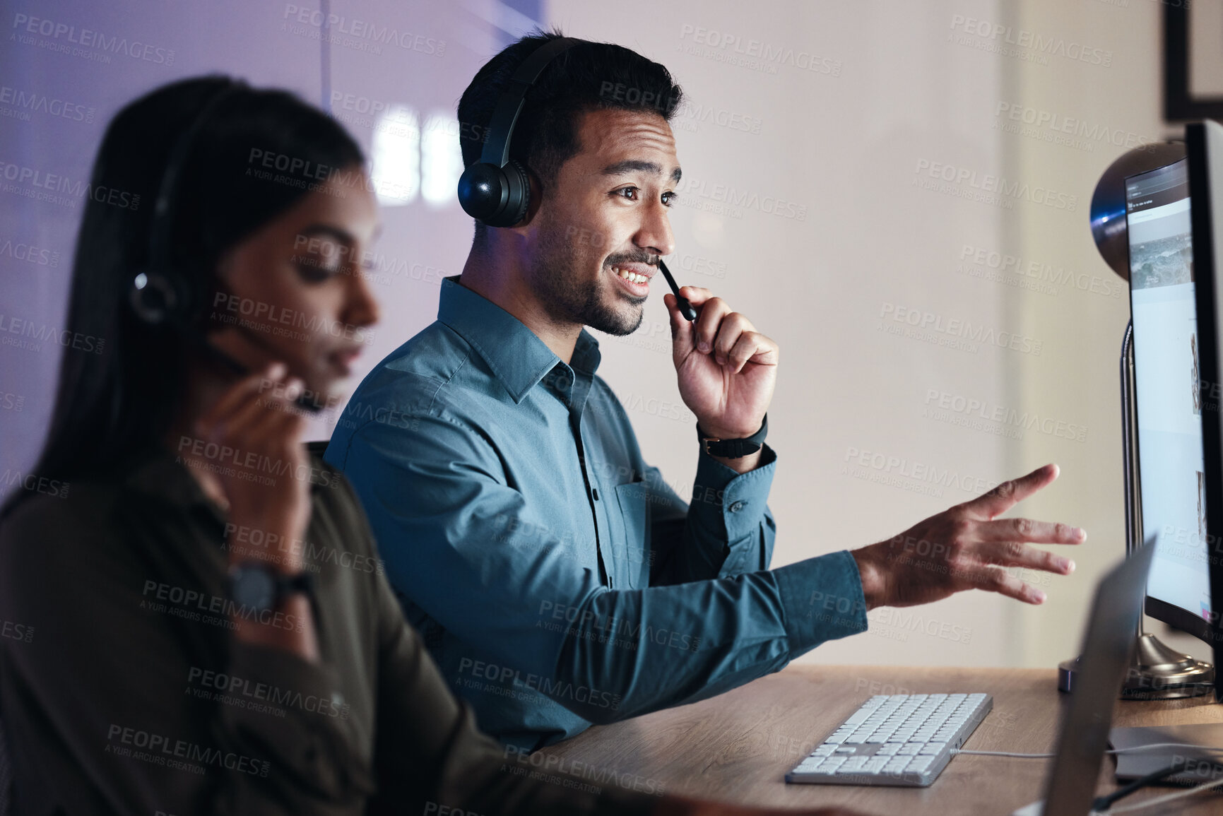 Buy stock photo Man, call center and headphones at night in customer service, support or telemarketing at the office. Happy male person, consultant or agent with headset on computer in online advice at the workplace