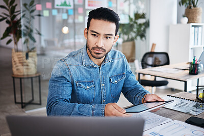 Buy stock photo Thinking, reading and man at desk with online report, laptop and digital research planning at design agency. Business, documents and tablet, employee with email or internet search at tech startup job