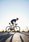 Mountain, fitness and man athlete on bicycle cycling training for a race or marathon in nature. Sports, workout and male cyclist riding a bike for cardio exercise on an outdoor off road trail.