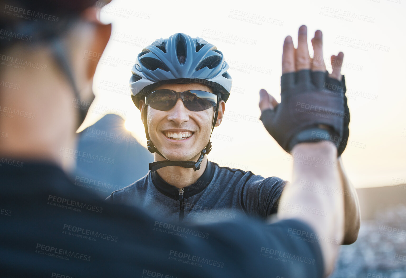 Buy stock photo Man friends, cycling and high five for teamwork, goal and success with winning, motivation and race in Cape Town. Cyclist team building, support and solidarity with smile, hands and happy for workout