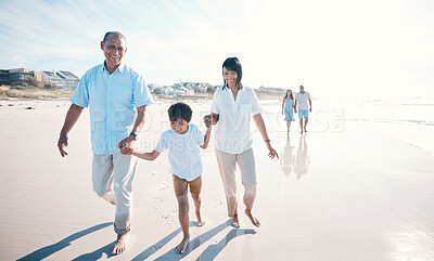 Buy stock photo Vacation, beach and grandparents walking child together at the sea or ocean bonding for love, care and happiness. Happy, sun and elderly people with kid on a summer travel holiday for freedom