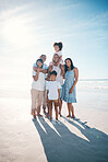 Vacation, beach and portrait of happy family together at the sea or ocean bonding for love, care and happiness. Happy, sun and parents with children or kids and grandparents on a holiday for freedom