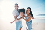 Beach, portrait and parents flying their kid on the sand by the ocean on a family vacation. Happy, smile and girl child holding and bonding with her young mother and father on tropical summer holiday