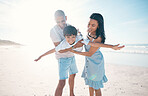 Beach, happy and parents flying their child on the sand by the ocean on a family weekend trip. Love, smile and boy kid holding and bonding with his young mother and father on tropical summer holiday.