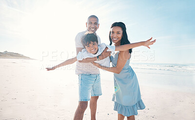 Buy stock photo Adventure, beach and parents holding their kid on the sand by the ocean on a family vacation. Happy, smile and boy child flying and bonding with hid young mother and father on tropical summer holiday