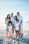 Beach, happy and portrait of a big family on a vacation, adventure or weekend trip for summer. Smile, bonding and children by the ocean with their parents and grandparents on tropical travel holiday.