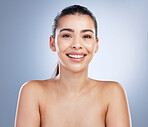 Skincare, beauty and portrait of a woman in studio for a natural, wellness or health face routine. Dermatology, self care and young female model with glow facial treatment isolated by gray background