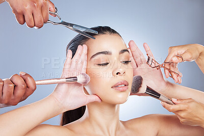 Buy stock photo Salon, makeup and face of woman with brush in studio for wellness, beauty and cosmetics on blue background. Cosmetology, hands and girl with brushes for cosmetic application, foundation and products