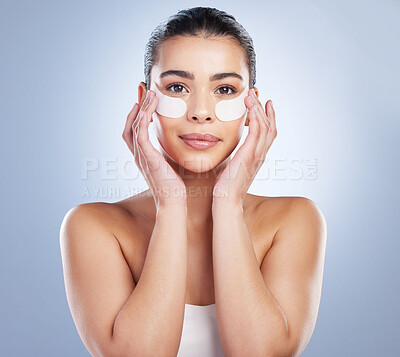 Buy stock photo Skincare, eye mask and portrait of woman in studio for wellness, healthy skin and facial. Dermatology aesthetic, salon and face of female person with patches for moisturizer, cosmetics and beauty