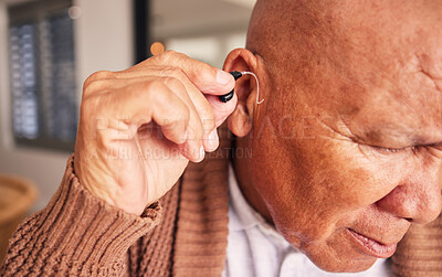 Buy stock photo Hearing aid, ear and a senior man with a disability in his home closeup for listening to noise or volume. Healthcare, medical or deaf with a mature male person in his retirement house for wellness