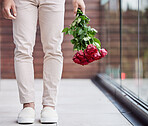 Love, legs and man with bouquet of flowers for date, romance and hope for valentines day. Romantic confession, floral gift and person holding red roses, standing outside for proposal or engagement.