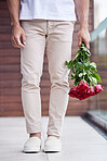 Hands, legs and man with bouquet of roses for date, romance and hope for valentines day. Love confession, romantic floral gift and person holding flowers, standing outside for proposal or engagement