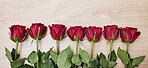 Background, row of flowers and roses in red color for valentines day, anniversary event and celebration of love. Closeup, banner and floral plants on table in line with mockup, space and decoration