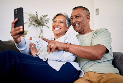 Buy stock photo Love, phone or happy senior couple pointing at social media post, retirement news article or relationship blog story. Cellphone, home and elderly man, old woman or people reading online marriage info