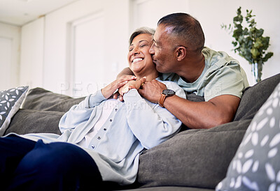 Buy stock photo Hug, surprise kiss and happy elderly couple bonding, relax and spending time together, smile and enjoy home retirement. Living room, love or senior man, old woman or sweet people with marriage care