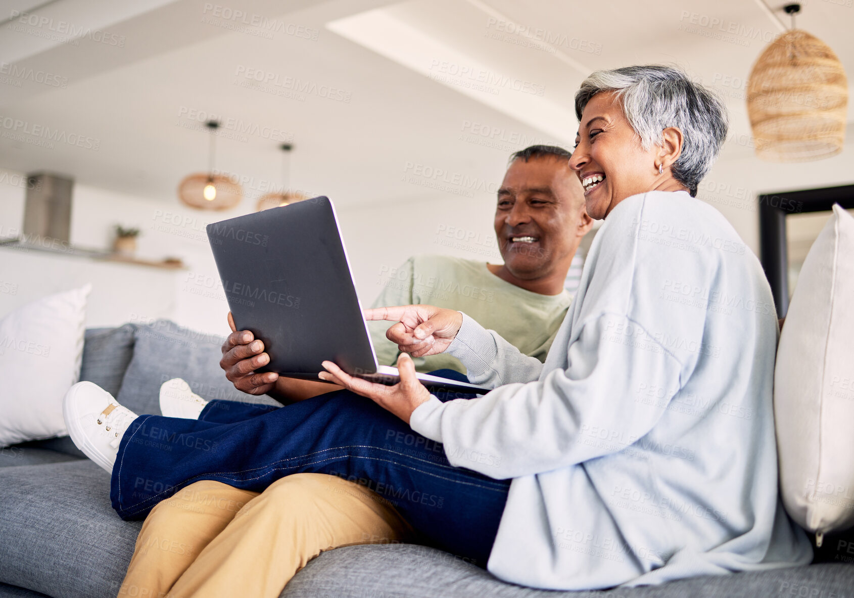 Buy stock photo Mature couple, laptop and relax on sofa in living room, download media and choice of watching movie together. Happy man, woman and computer for streaming online video, web subscription and internet