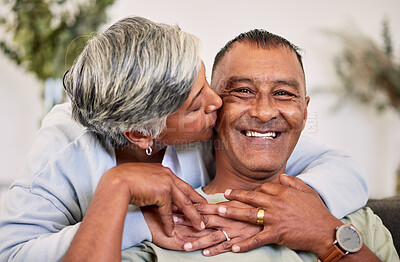 Buy stock photo Love portrait, kiss and happy elderly couple bond, relax and enjoy time together, smile and retirement wellness. Home apartment, sofa and face of elderly man, woman or people with marriage happiness