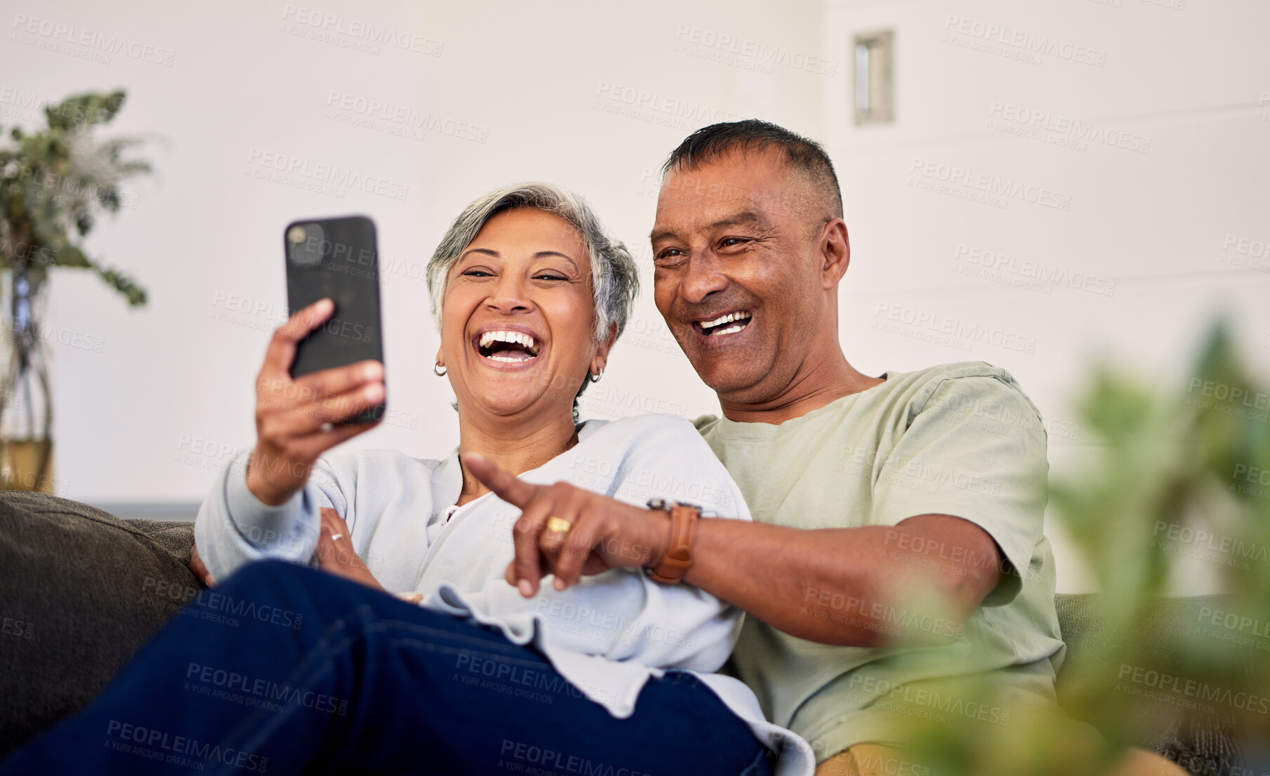 Buy stock photo Love, phone and senior couple laughing at funny social media meme, online comic or streaming comedy video. Smartphone application, marriage humour and elderly people laugh at retirement joke at home