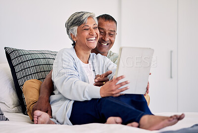 Buy stock photo Happiness, bedroom tablet and elderly couple laughing at funny social media meme, comic or streaming comedy video. Funny morning news article, home bed and senior bonding people laugh at online joke