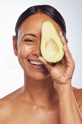 Buy stock photo Face, skincare and senior woman with avocado in studio isolated on a white background. Happy, natural fruit or portrait of mature model with food for nutrition, healthy diet or omega 3 for anti aging